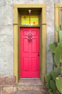 Pink front door uses bright spring color for pop at entry