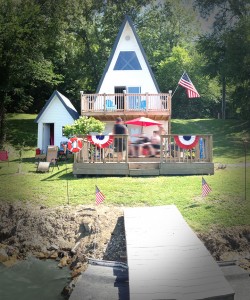 The Tiny Lake House last year, after receiving a new roof, siding, and a cute "mini-me" storage building.